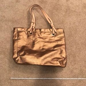 Gold colored handbag